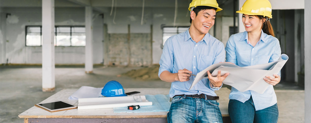 Two young engineers on worksite