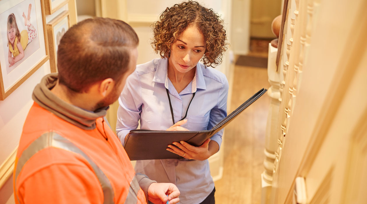 Real estate agent speaking to a building inspector