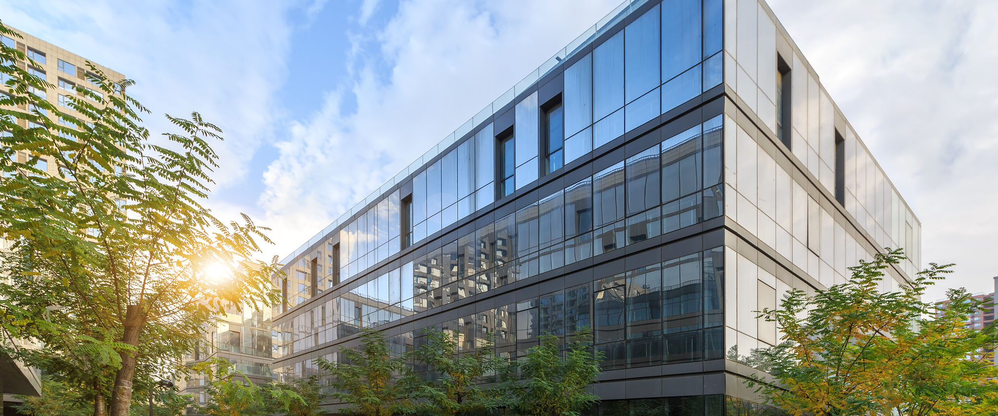 Exterior shot of commercial building during sun set.